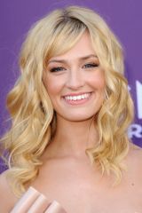 Beth Behrs as Caroline Channing
