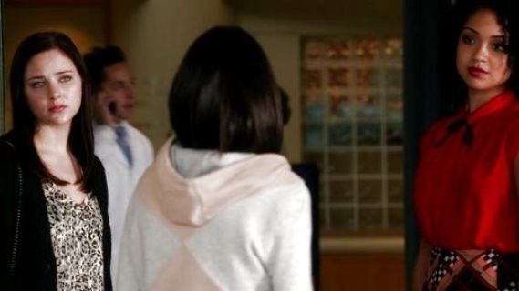 Beth Kingston's Collared Cap-Sleeve Pleated Blouse in Red on Chasing Life