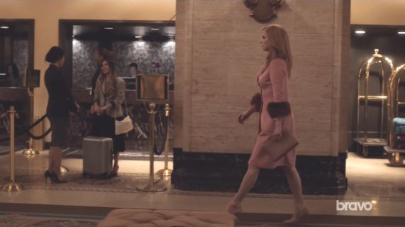 Donna Paulsen's Long wool coat with fox fur cuffs on Suits