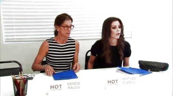 Heather Dubrow's Black Patent Leather Half Moon Clutch on The Real Housewives of Orange County