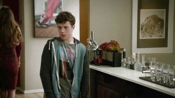 Luke Dunphy's Cotton T-Shirt with Aloha Never Dies Photographic Print on Modern Family