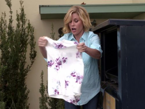 Claire Dunphy's White Floral Print Blouse on Modern Family