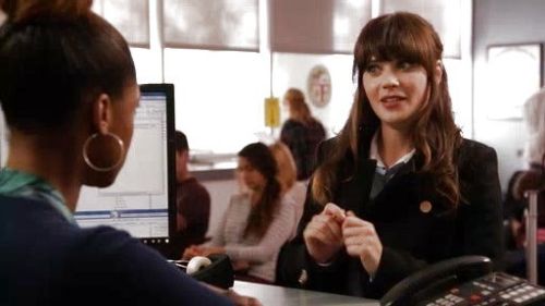 Jess Day's navy blue peacoat on New Girl