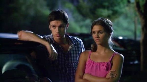 Emma Becker/Sutton Mercer's Geranium Pink Trina Turk Silk Bow Top on The Lying Game